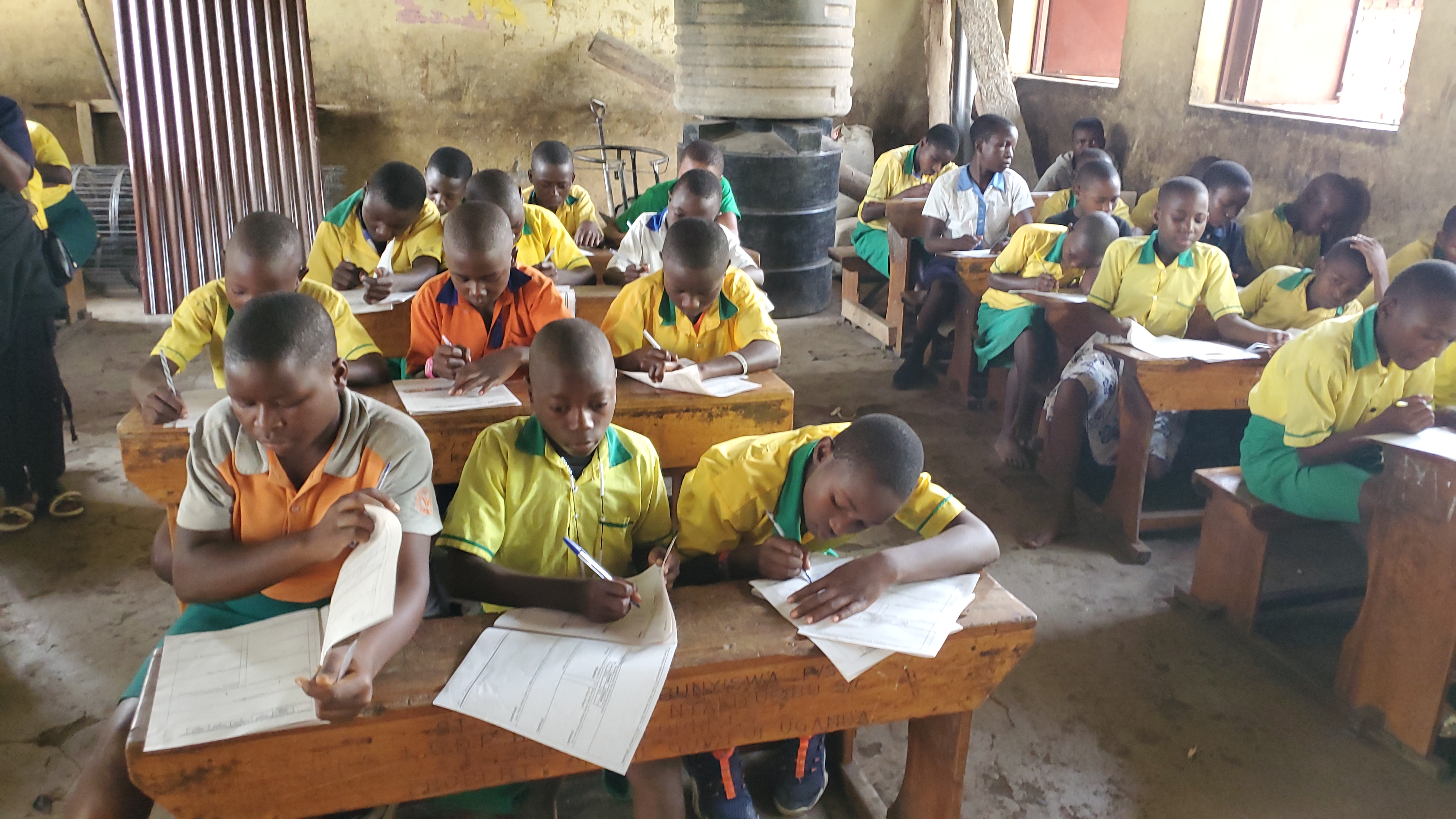 Providing Learning Materials and Examinations at St. John Paul Bunyiswa Primary School